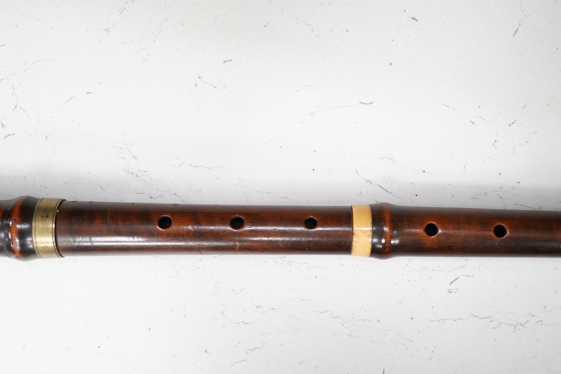 A 19th century crocus wood and ivory flute possibly by Metzler, six holes and one key to the foot joint, 60.5cm long, ivory submission ref: HMMH3U4M